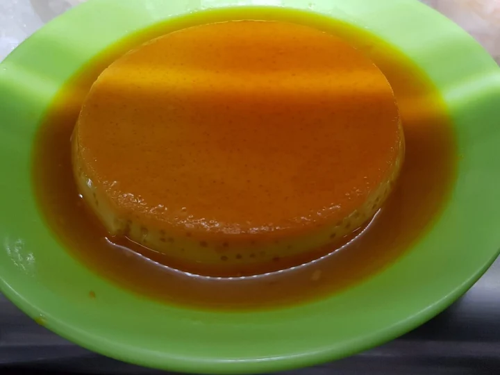 A caramel custard flan in its sauce