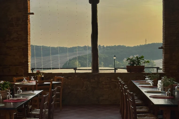 Tables by a wide window at sunset