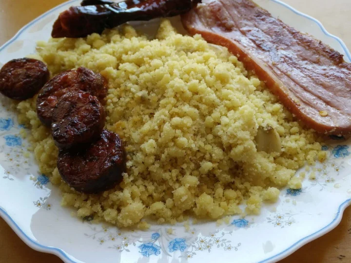 Fried breadcrumbs with chorizo, black pudding and bacon on a plate