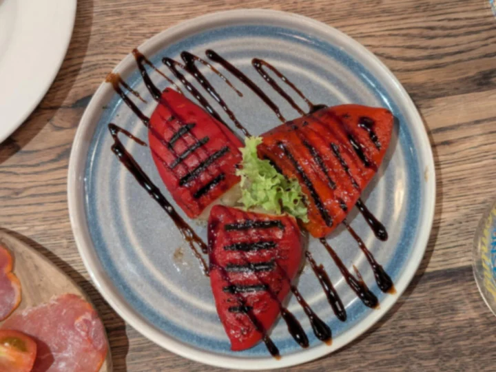 Roasted red peppers with a balsamic glaze on a plate