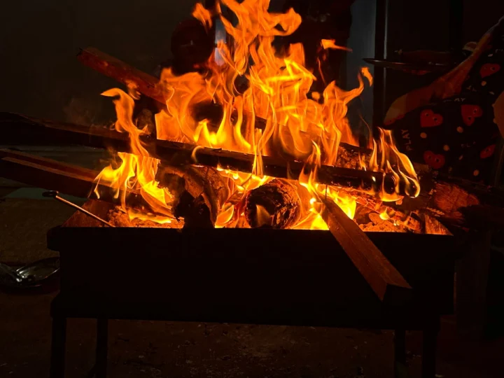 Flames rising from a wood fire in a brazier